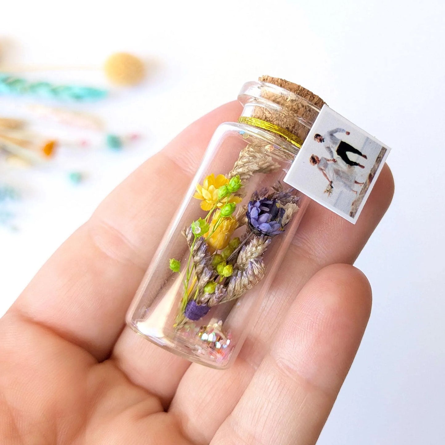Personalized anniversary message bottle with photo and dried flowers